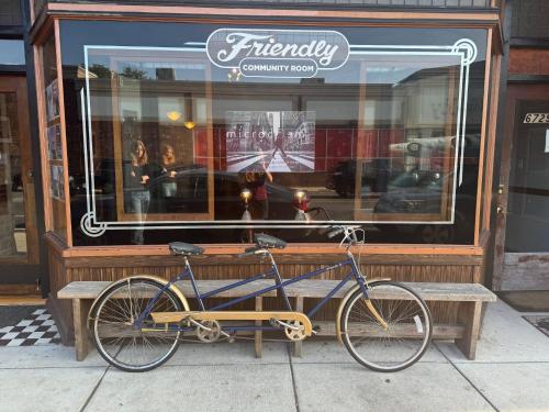 a bike is parked in front of a store at Friendly Songbird Suite in Berwyn