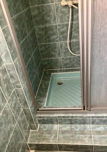 a bathroom with a shower with a shower at Windmill Cottage of Monpazier in Capdrot