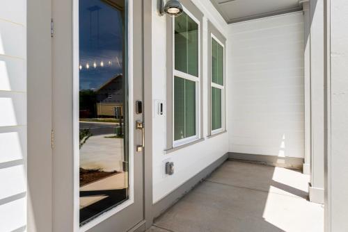a front door of a house with a window at 3Zs Beach House 30A Sleeps 10! in Inlet Beach