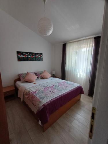 Postel nebo postele na pokoji v ubytování Apartment Ivkica