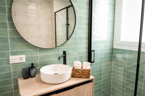 a bathroom with a sink and a mirror at Ocean views from every corner in Almería