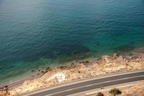 an aerial view of a road next to the ocean at Ocean views from every corner in Almería