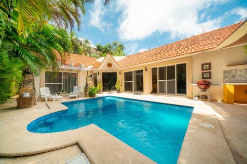 a swimming pool in the backyard of a house at Luxury Villa 4BR with Private Pool - At Playacar ll - Villa Perla 15 in Playa del Carmen