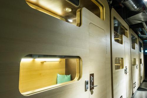 the inside of a train compartment with the door open at Bo Hotel in Stockholm