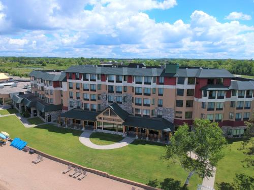 an aerial view of a large building with a park at SouthShore Hotel on Lake Bemidji, Trademark Coll by Wyndham in Bemidji