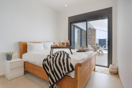 Ένα ή περισσότερα κρεβάτια σε δωμάτιο στο Villa Monastrell
