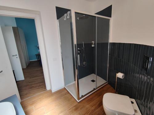 a bathroom with a shower with a toilet in it at La Terrazza Del Sole di Mondello in Palermo