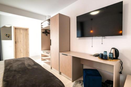 Postel nebo postele na pokoji v ubytování Hotel-Apartments Roxy&Maryo