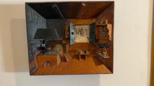 a painting of a living room with a table at Il Cadorino in Valle di Cadore