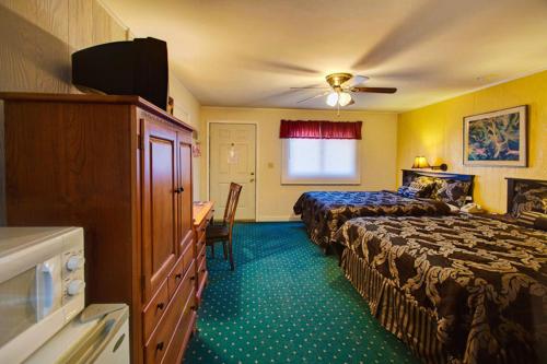 מיטה או מיטות בחדר ב-Margaretville Motel