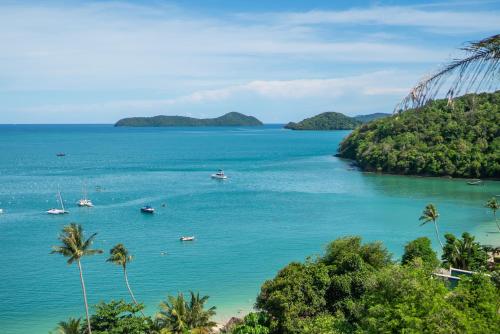 a view of a bay with boats in the water at mona seaview pool villa beach front AoYon Beach in Ban Ao Makham