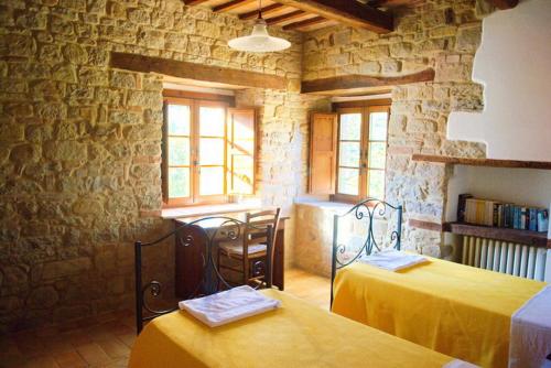 Postel nebo postele na pokoji v ubytování Agriturismo Elisei