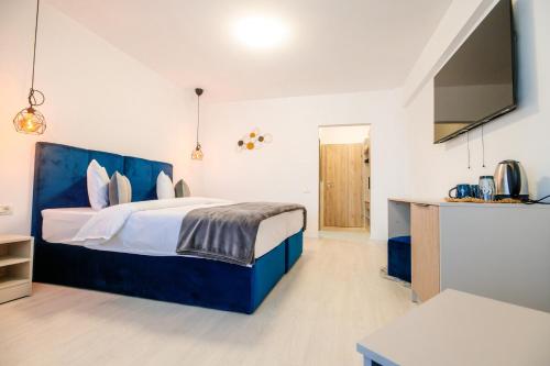 Postel nebo postele na pokoji v ubytování Hotel-Apartments Roxy&Maryo