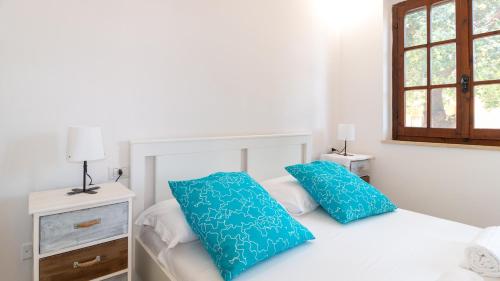 Кровать или кровати в номере Casa Sole e Mare by Sardinianworld