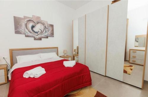 Giường trong phòng chung tại Casa Vacanza Boeo con Jacuzzi
