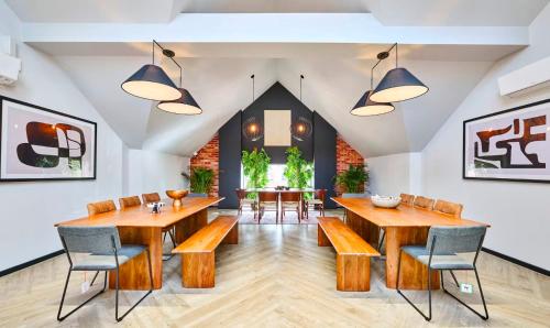 a dining room with wooden tables and chairs at For Students Only Accommodation in the Heart of York in York