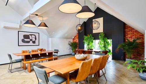 a dining room with a wooden table and chairs at For Students Only Accommodation in the Heart of York in York