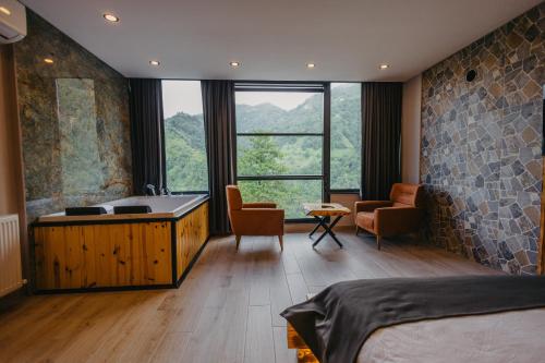 Ένα ή περισσότερα κρεβάτια σε δωμάτιο στο merzesuitotel