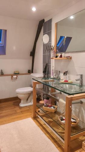 a bathroom with a sink and a toilet at Nuit insolite tente Grandi'Ose proche Mont Saint Michel in Le Ferré