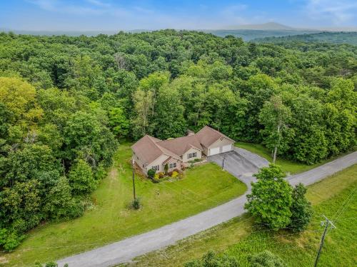 an overhead view of a house on a road at Otter Manor - Wifi - Fire Pit - Gameroom- Grill - Private Trail in Berkeley Springs