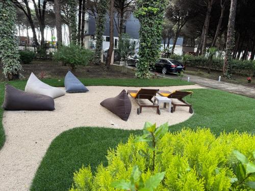 a park with chairs and tables and sidx sidx sidx sidx sidx sidx at Villa Zen Oasis in Golem