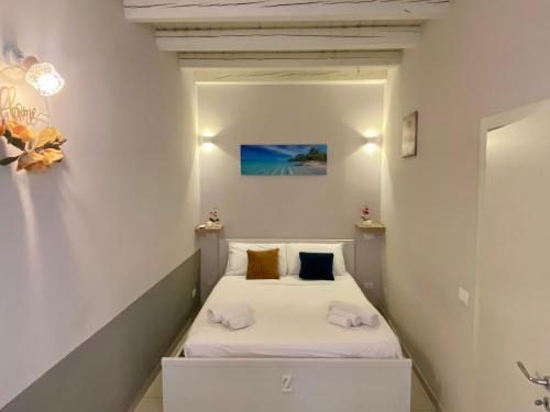 Posteľ alebo postele v izbe v ubytovaní Cozy apartment near Palermo Cathedral