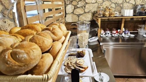 a bunch of bread on a table in a bakery at SEDRA Holiday Resort-Adults Only-Bed & Breakfast in Grabovac