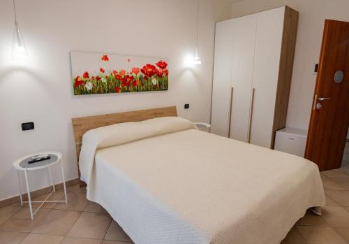 Postel nebo postele na pokoji v ubytování B&B SediciMarzo