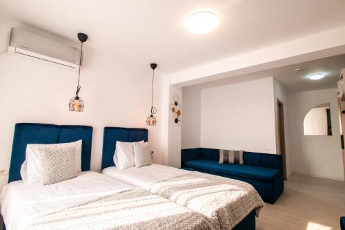Postel nebo postele na pokoji v ubytování Hotel-Apartments Roxy&Maryo