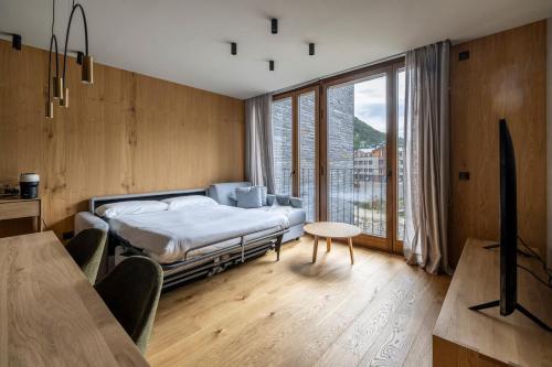Ένα ή περισσότερα κρεβάτια σε δωμάτιο στο Luxury Mountain Stay l GYM - SAUNA - POOL l by BonesVacances