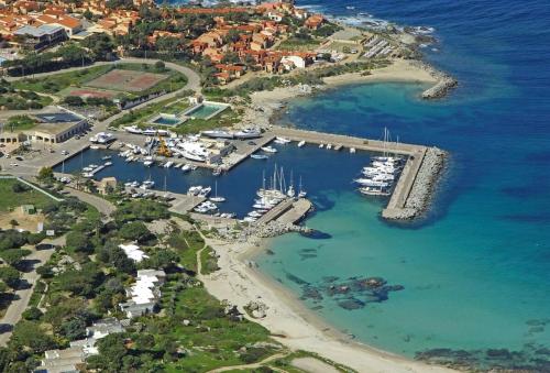 an aerial view of a harbor with boats in the water at La Pointe de Sel - Plage a 2 minutes a pied in Lumio