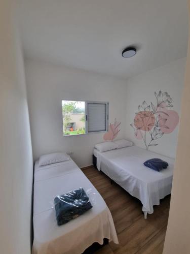 Katil atau katil-katil dalam bilik di Casa Moderna com Itens de Lazer