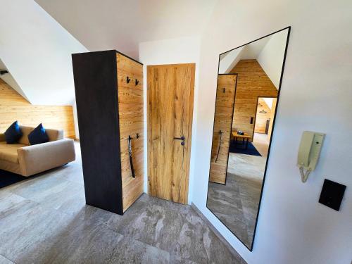 a room with a mirror and a couch at Bodensee Apartment Seenest in Meersburg