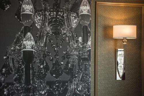 a chandelier on the wall in a room at The Delavan Hotel in Buffalo
