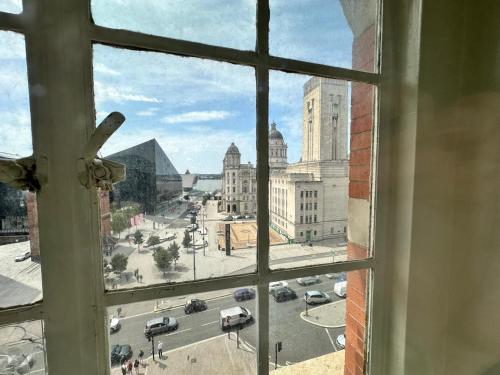 a view of a city street from a window at White Star Line Hotel in Liverpool