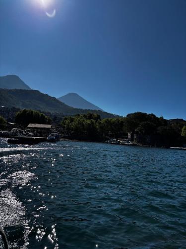 a view of a body of water from a boat at Paradise of Atitlan in Santiago Atitlán
