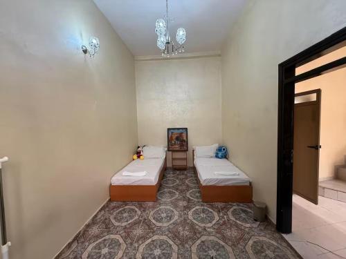 Ένα ή περισσότερα κρεβάτια σε δωμάτιο στο Charmante Maison Traditionnelle au Cœur de la Médina, 5 min de Casa Port