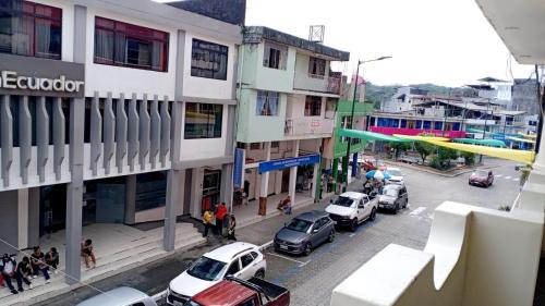a view of a city street with cars parked at Gran Hotel Amazónico in Puyo