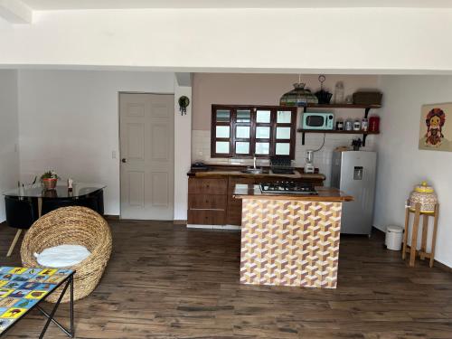 a kitchen with a counter top and a refrigerator at Casa en tlaquepaque in Guadalajara