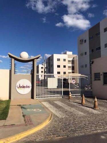 a gate with cones in front of a building at Apto 2 quartos com ar - Fechadura eletrônica - Até 8 pessoas in Petrolina