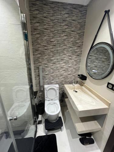 a bathroom with a toilet and a sink and a shower at Najla Sh4 in Tangier
