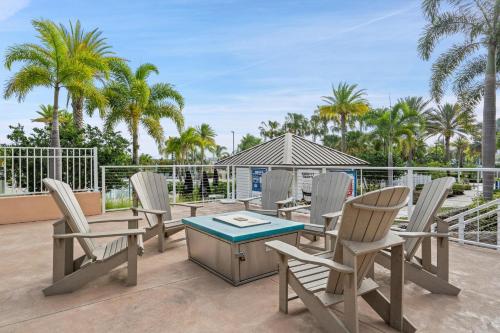 a group of chairs and a table on a patio at 2147 Cooper Bell in Kissimmee