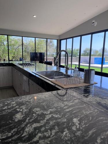 a kitchen with a sink and a counter top at Rancho Florean in Montemorelos