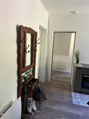 a room with a mirror on a wall at Senones Jardin de la princesse in Senones