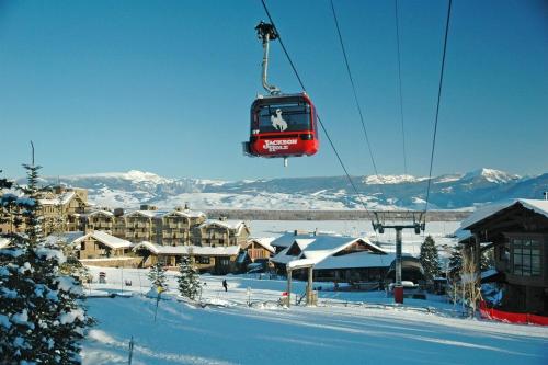 a ski lift in the air over a snow covered town at New Listing, Blue Cabin, Downtown, Cozy Getaway in Driggs