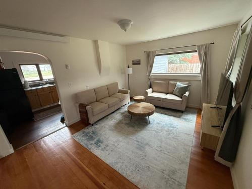 a living room with a couch and a table at New Listing, Blue Cabin, Downtown, Cozy Getaway in Driggs