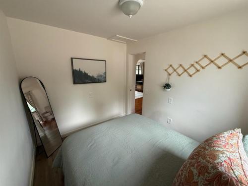 a bedroom with a bed in a room at New Listing, Blue Cabin, Downtown, Cozy Getaway in Driggs