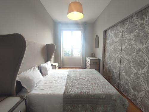 a bedroom with a large bed and a window at La Redorte Appartement au château 8 in La Redorte