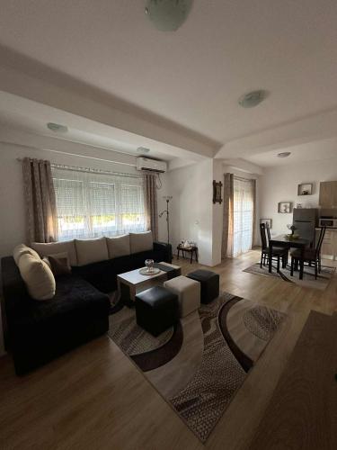 a living room with a couch and a table at ILIEVSKI apartment 4 in Kumanovo