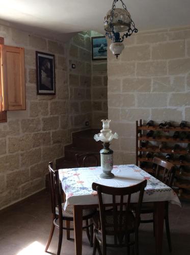 a dining room with a table and some chairs at Favignana Vacanze in Favignana